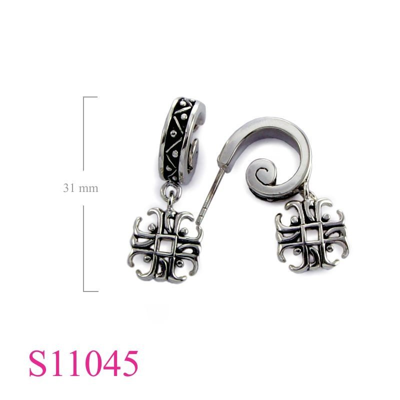 Earrings, swirl stud and hanging cross.