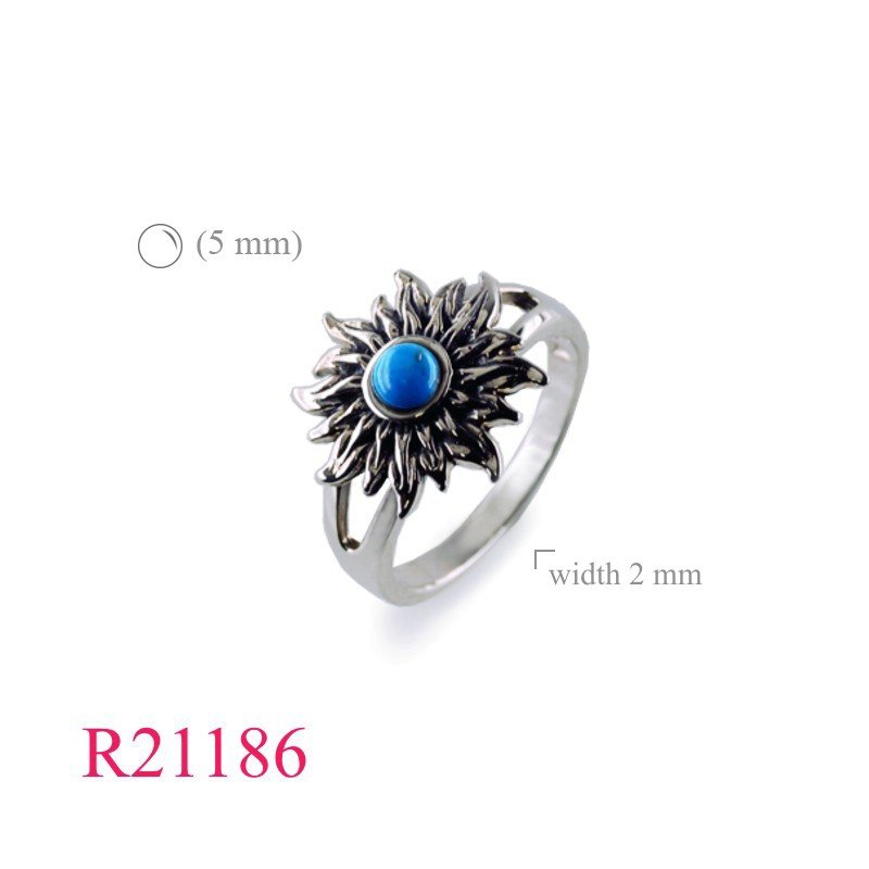 Ring, sun design with round cabochon stone.