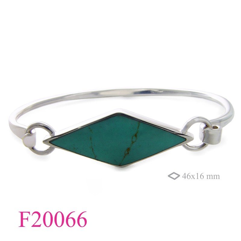 Bangle, long diamond shape stone.
