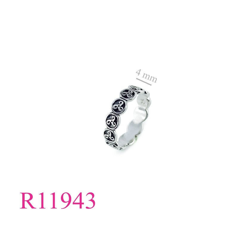 <p>Ring, small round Triskellions around.</p>