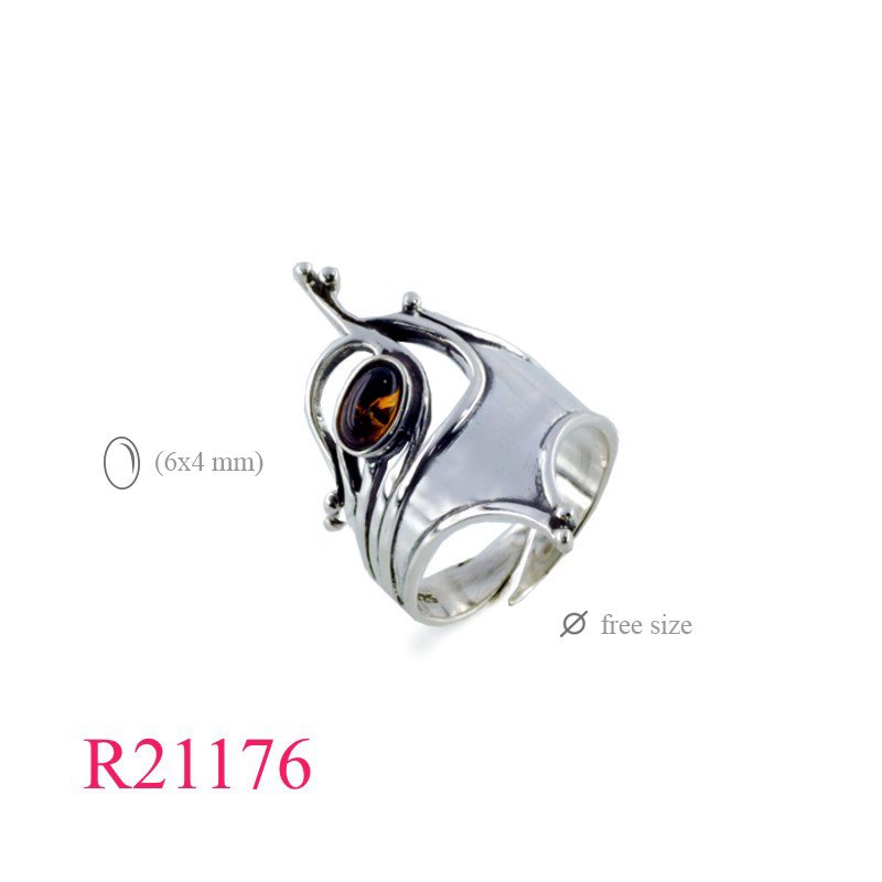 <p>Ring, antique design free size with oval Amber.</p>